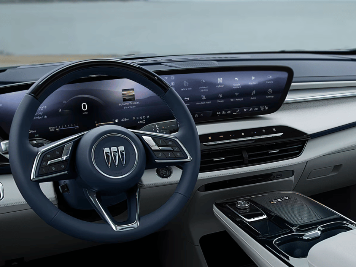 Interior view of the 2025 Buick Encore GX with digital display, infotainment controls, and steering wheel showcasing a quiet cabin environment